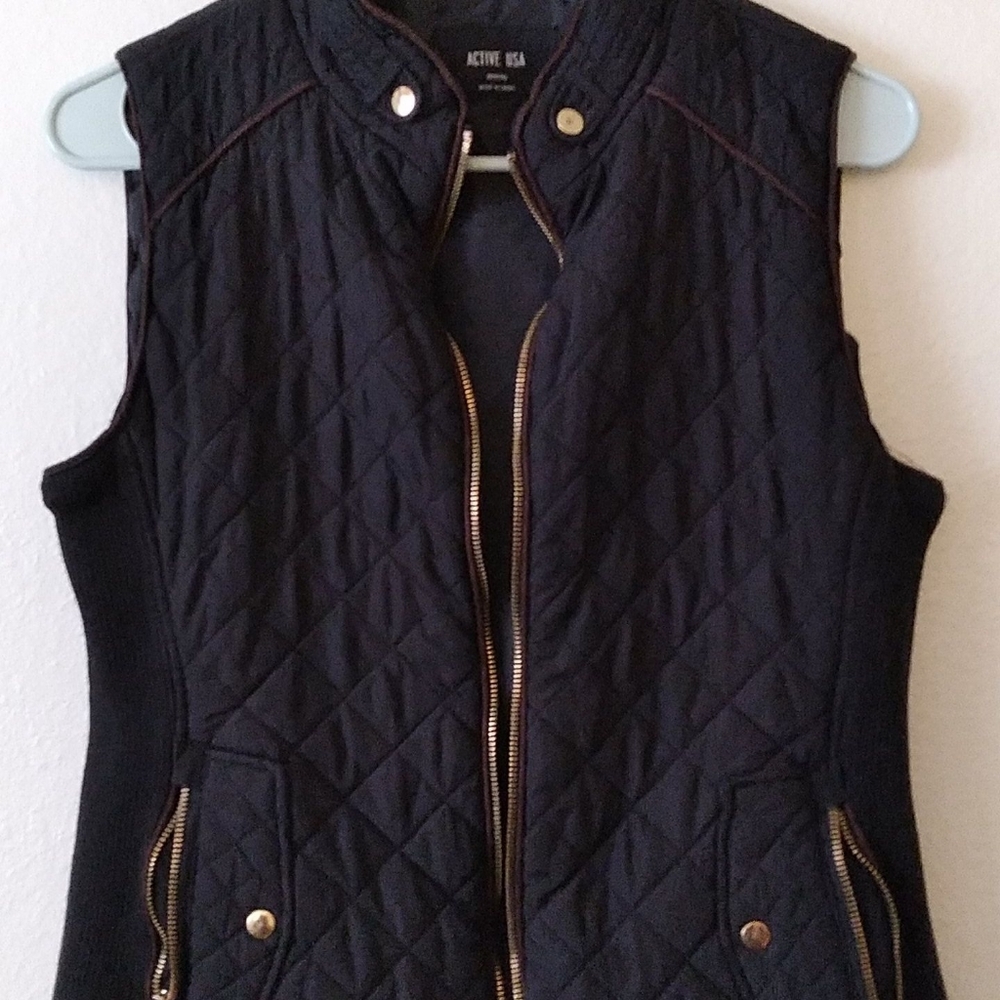 Black and gold vest